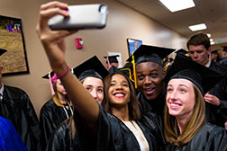 Graduates taking a selfie. Link to Gifts That Protect Your Assets